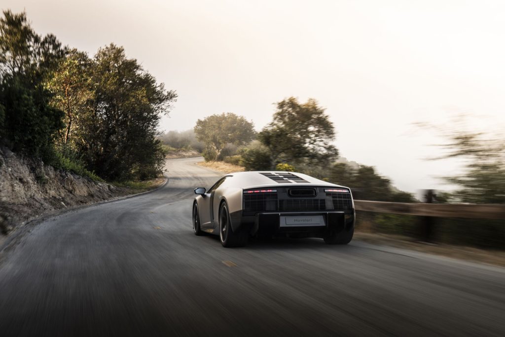 Audi Nuvolari, rear three-quarter, driving on a mountain road