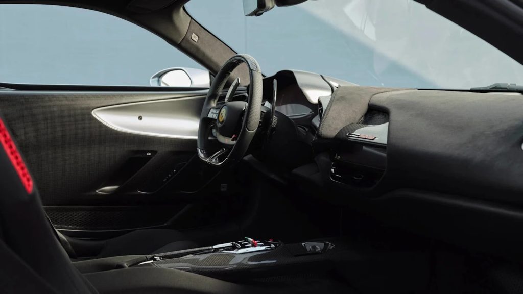 Ferrari CZ26 interior showing the steering wheel and red accent stripe