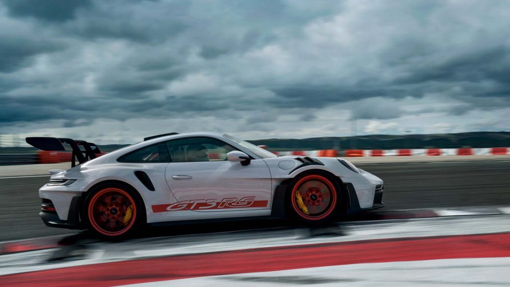 Porsche 911 GT3 RS cornering on a racetrack